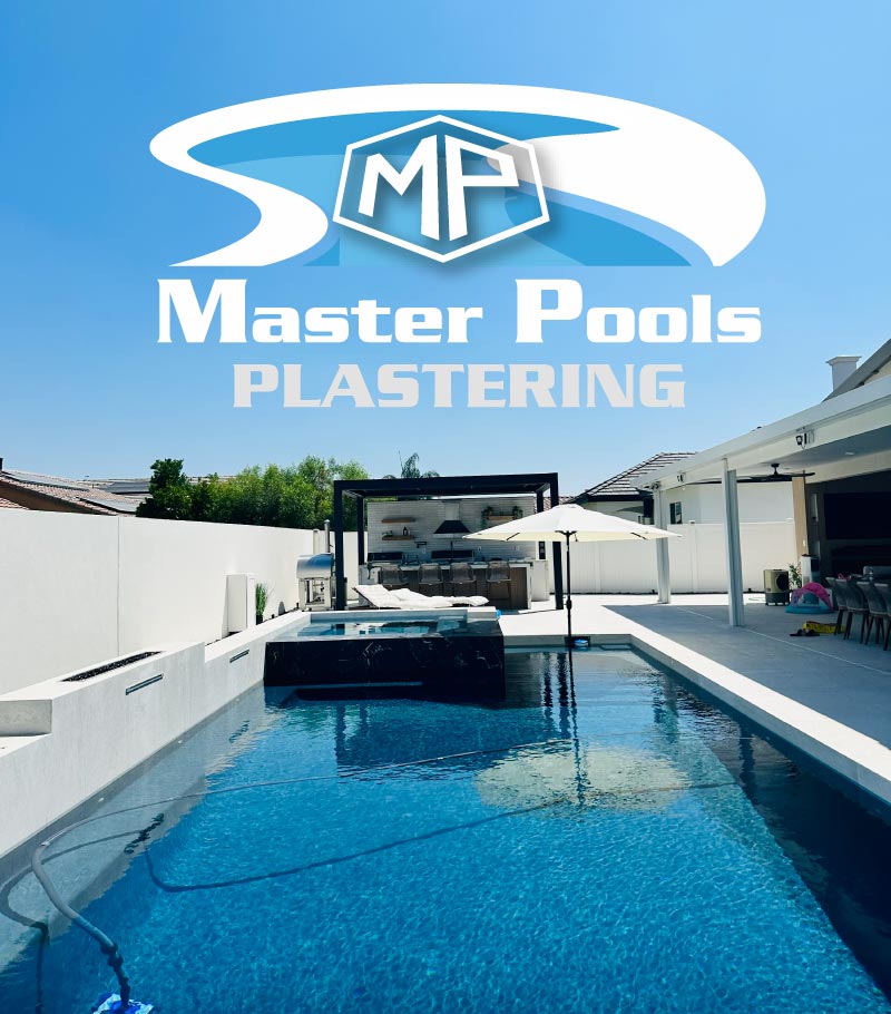Modern residential pool in Bakersfield featuring a premium deep-blue plaster finish and custom spa, expertly installed by Master Pools Plastering, a licensed contractor.